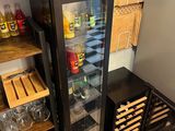 a refrigerator that has a lot of bottles in it