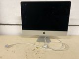 a computer that is sitting on a table with a cord