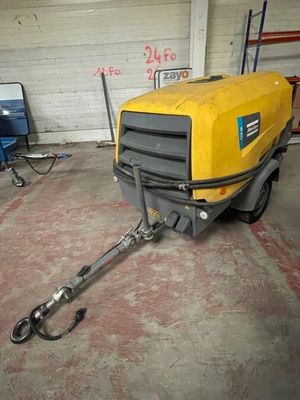 a yellow machine that is parked in a garage