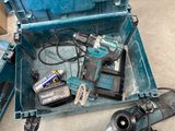 a blue tool box with tools in it on the floor