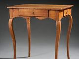 a small wooden table with a drawer on top of it