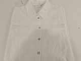 the shirt is white and has a button down collar