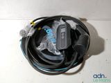 a cable that is connected to a device on the floor