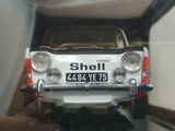 a toy car that is on display in a glass case