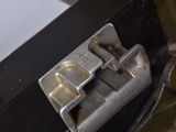 a close up of a metal latch on a metal object