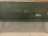 a glass coffee table with a metal base and a glass top