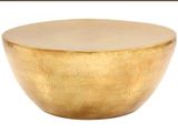 a close up of a gold bowl on a white background