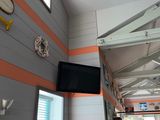 a picture of a room with a tv and a window