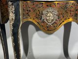 a small table with a lion head on it