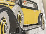 a picture of a picture of a yellow car on the wall