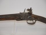 an old gun that is on display in a museum