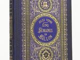 un vieux livre à la couverture bleue ornée de dorures
