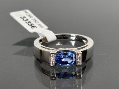 an image of a blue sapphire and diamond ring