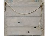 a wooden box with a rope on the side