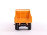 a toy dump truck that is sitting on a white surface