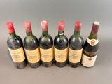 six bottles of wine lined up in a row on a table