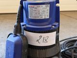 an image of a blue and black submerst sitting on the floor