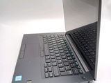 a laptop that is open on a white surface