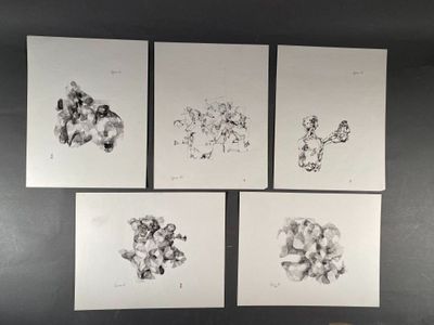 four prints of animals on the wall above a bed