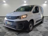 the white van is parked on a checkered floor in a garage