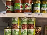 many jars of food on the shelves in the store