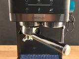 a coffee machine that is sitting on a wooden table