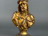 an antique bronze bust of jesus with a crown of thorns on his head
