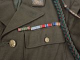 an image of a military uniform with a medal and a tie