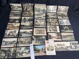 several old black and white photographs of a town and a street