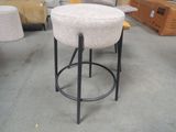 a stool that is sitting in the middle of a room