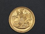 an image of a gold coin with the image of a man on a horse