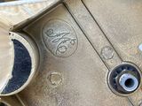 a close up of an old suitcase with a sticker on it