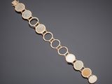 a gold and mother of pearl bracelet
