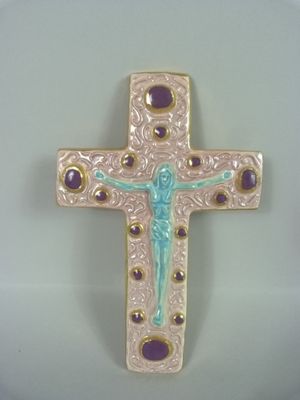 purple and gold cross with a crucift on it on a white surface