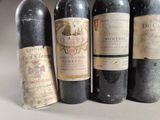 several bottles of wine are lined up on a table