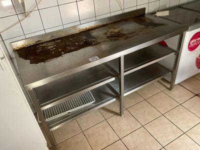 an image of a dirty kitchen with a dirty counter top