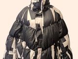 black and white jacket on mannequin head on white background