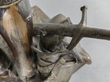 a statue of a man riding a horse with a bird on his back