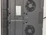 a laptop with two fans attached to the back of it