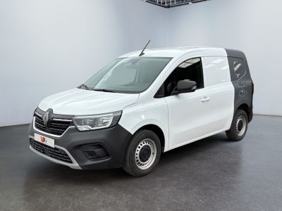 the white van is parked in a large room with a ceiling fan