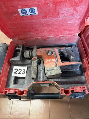 a red tool box with tools in it on the floor