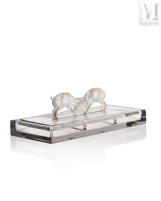 crystal figurine of two birds on a branch on a clear base