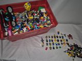 a red box full of legos on a white sheet