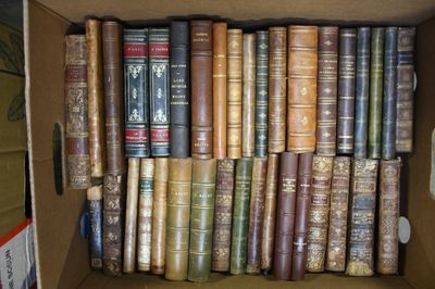 a box full of old books sitting on a table