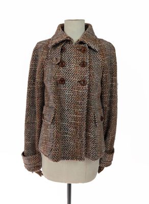 veste en tweed posée sur un mannequin
