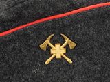 an image of a hat with two crossed axes on it