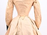 the back of a beige dress on a mannequin mannequin mannequin mannequin mannequin mannequin mannequin mannequin