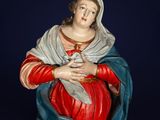 an image of a statue of a woman holding a baby