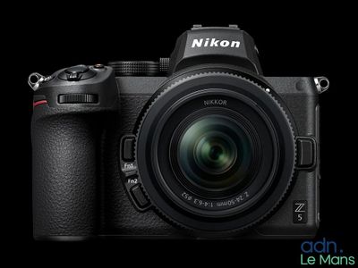 a close up of a camera with a lens attached to it