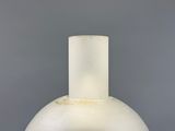 an image of a white vase on a table